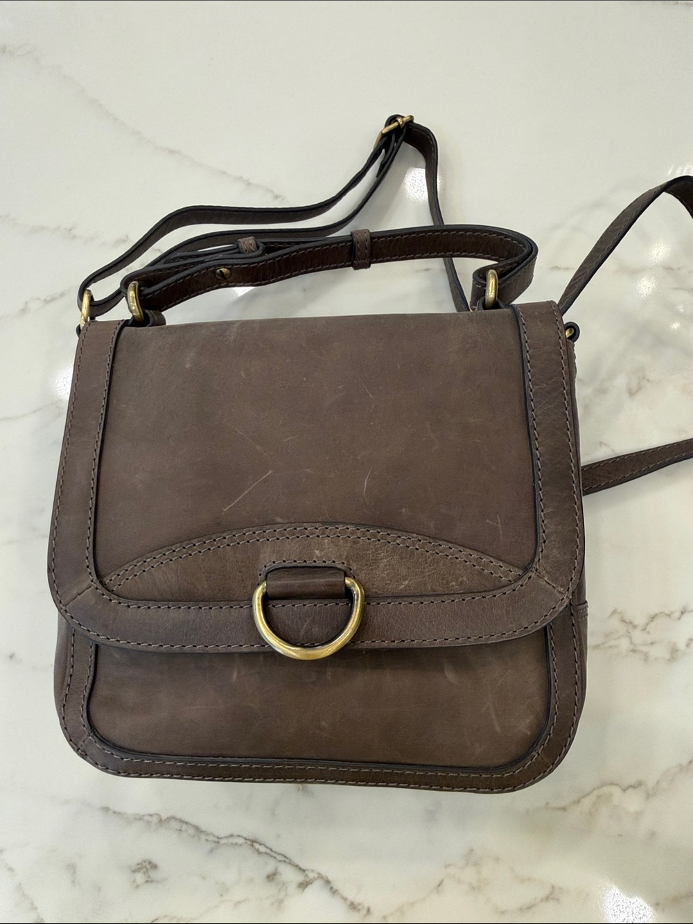 Dina True Taupe/Gray saddle bag purse.